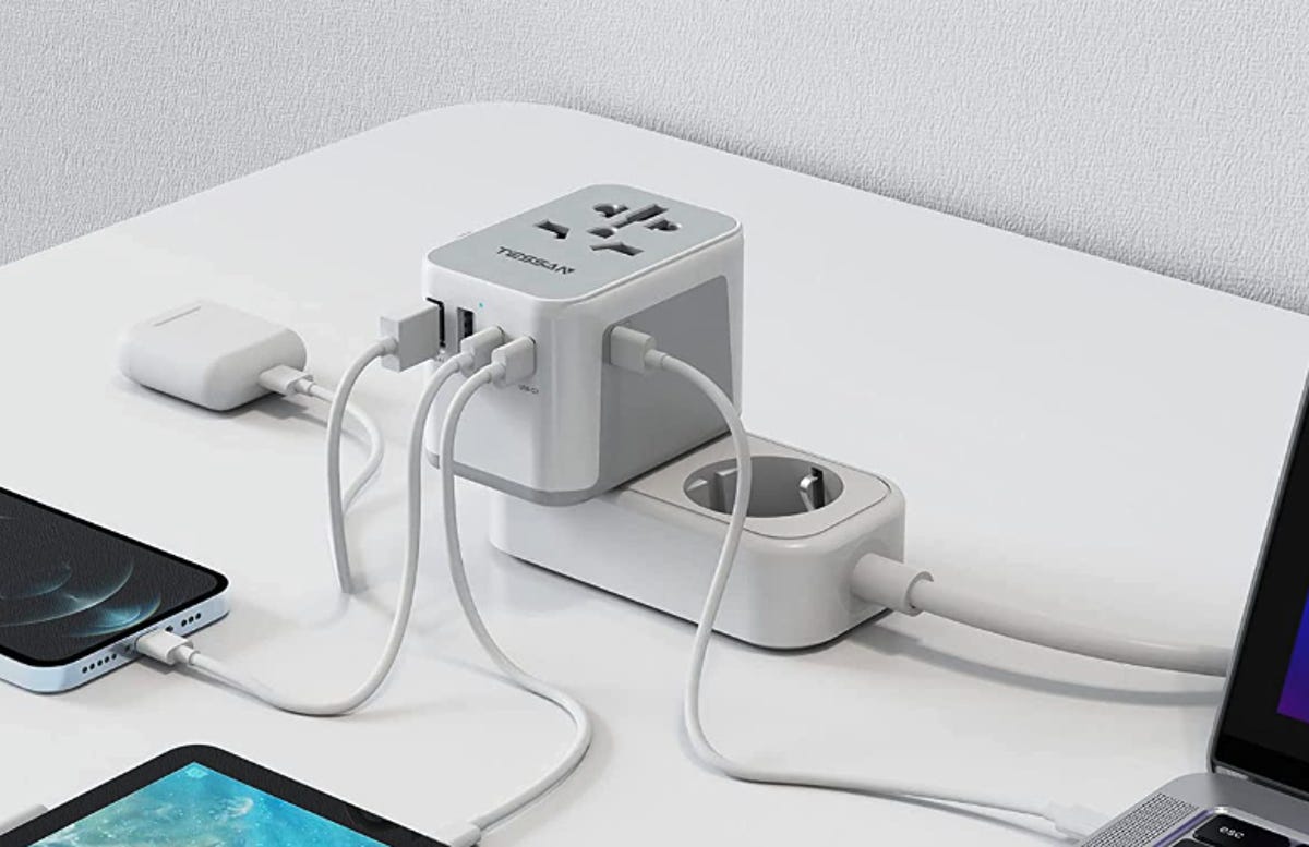 travel adapter with many items plugged in